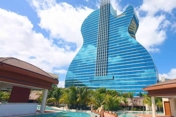 cabanas-with-guitar-hotel-in-background-daytime-3150x2150