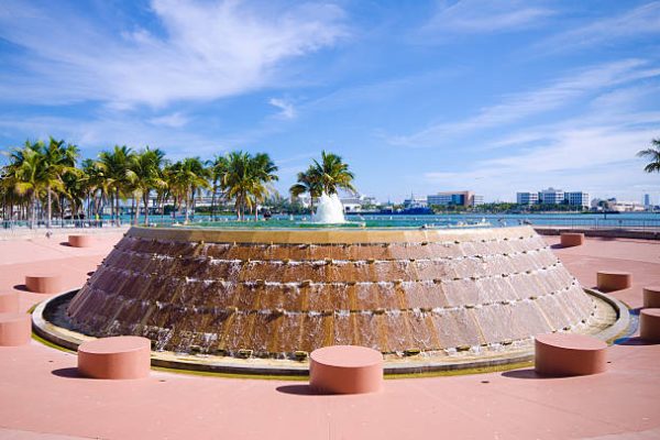 "Fountain at Bayfront Park in the downtown area of Miami, FL with Biscayne Bay in the distance."